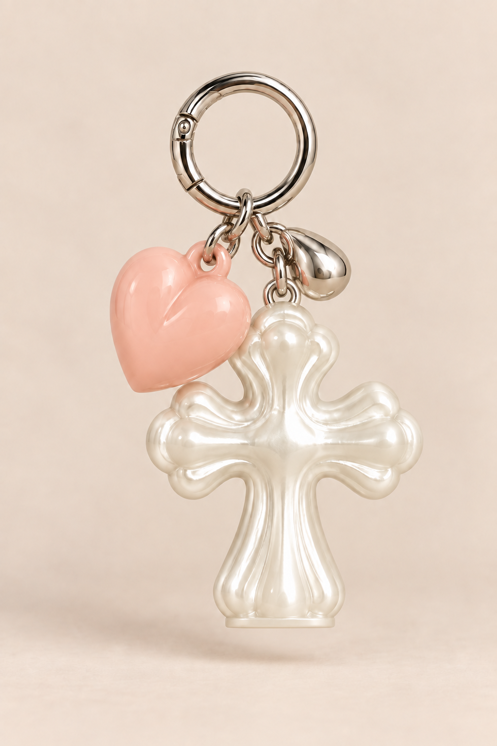 Close-up of pearlescent cross and pink heart details